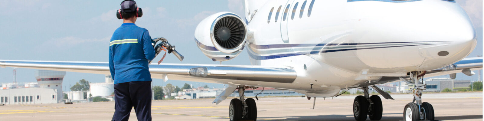 Refueling the jet plane at the airport