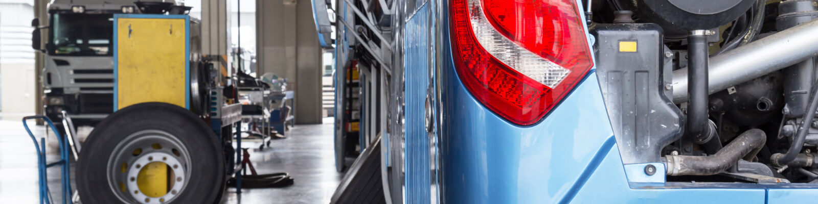 bus and truck waiting for service in the garage