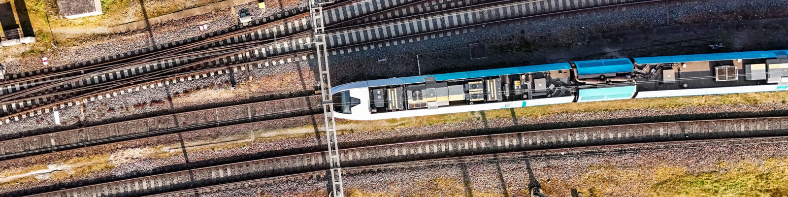 Railroad, train tracks and train aerial drone view from above, r