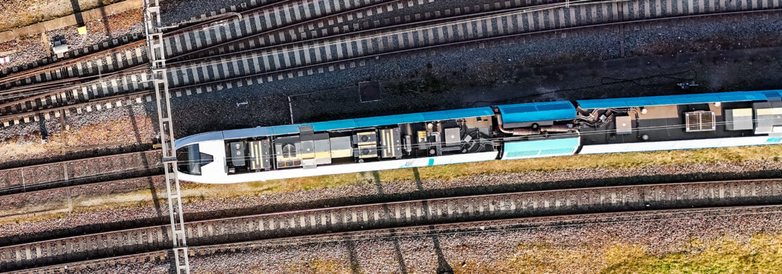 Railroad, train tracks and train aerial drone view from above, r